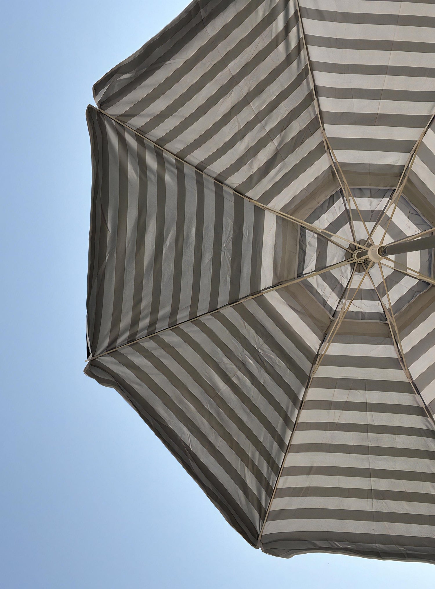 Introducing PortaBrella®, the world's most versatile travel beach umbrella on the market! Boasting a full umbrella arc of over 76 inches when open, the PortaBrella® ingeniously collapses to a mere 24 inches x 4 inches, effortlessly fitting into most suitcases. Weighing just 4.5 pounds, it's the perfect companion for vacation-goers or beach enthusiasts who lack the space to carry a full-sized umbrella.